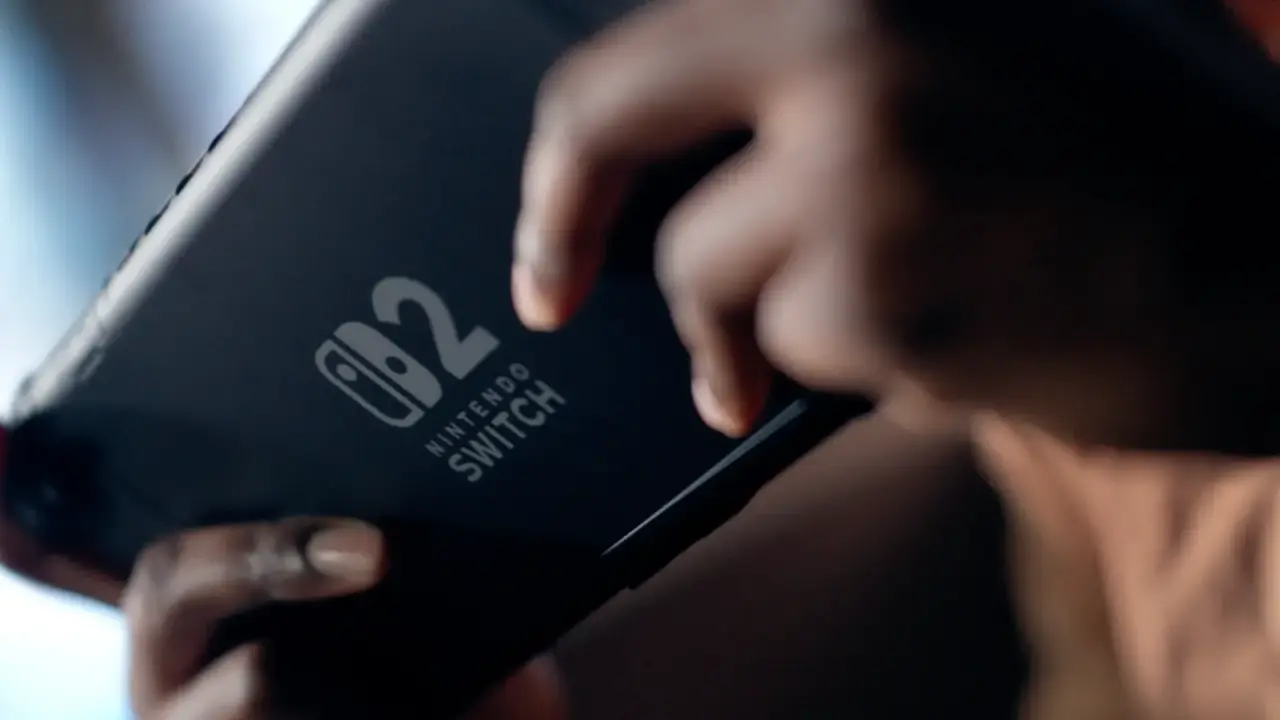 A player holding a Nintendo Switch 2 in handheld mode